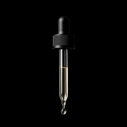 Black dropper with clear liquid on a black background cbd oil