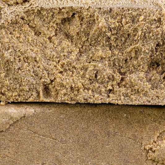 Close-up of Super Pollen THCA hash showing fine sifted resin structure