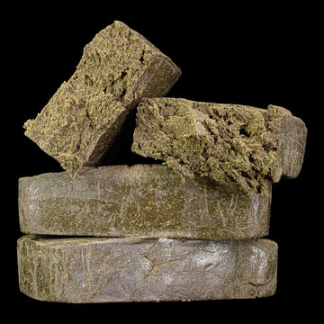 Manali Cream 40% THCA hand pressed dry sift hash with oily resin surface
