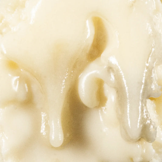 Close-up of THCA badder concentrate showing smooth creamy consistency