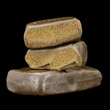 Farfar's Favorit 30% THCA hybrid hash with dark fibrous texture